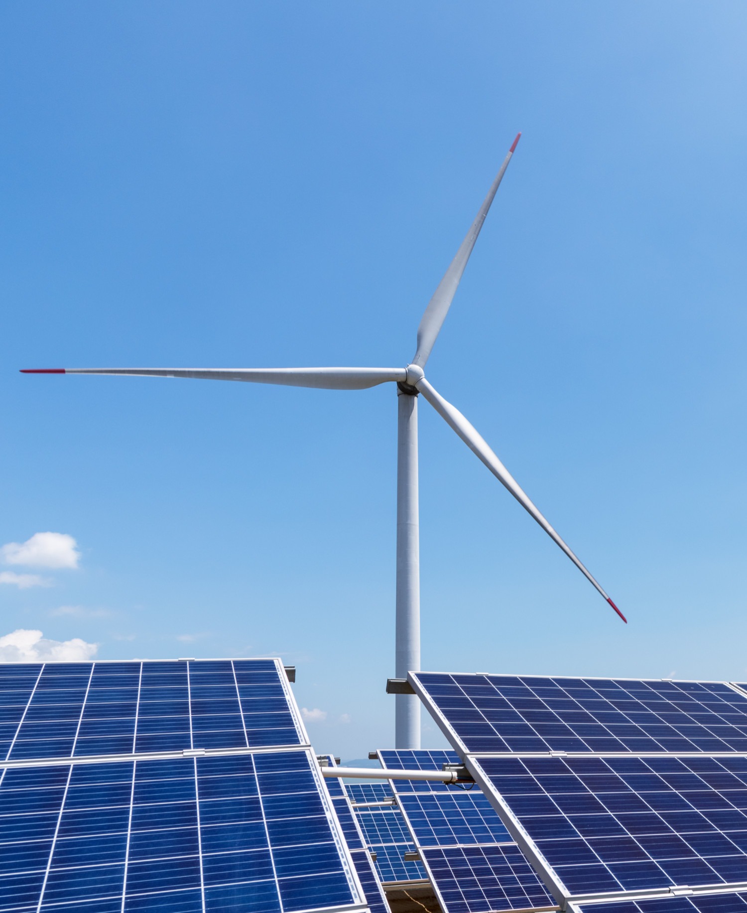 wind turbine over solar panels